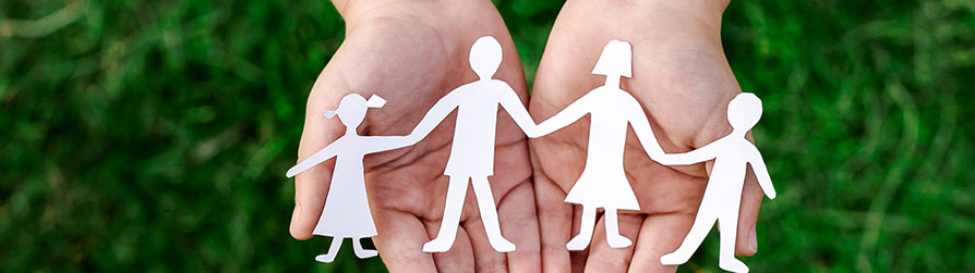 Paper silhouette of family holding hands